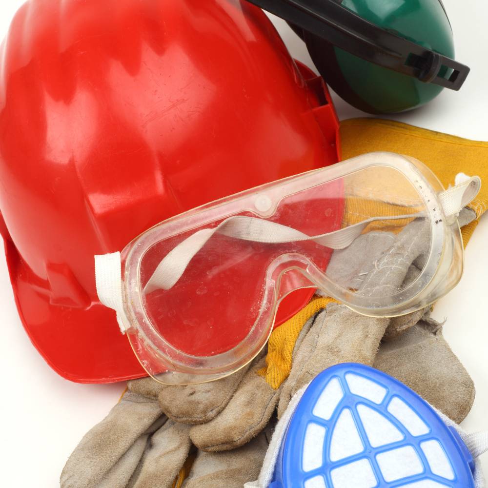 Industrial safety equipment including a helmet and ear defenders
